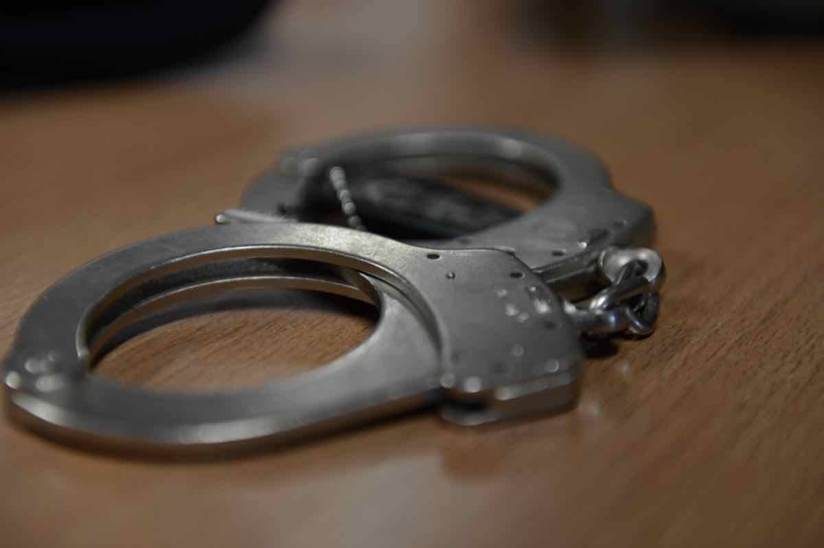 Handcuffs on table, assault and domestic violence charges Mississauga Peel Region criminal defence