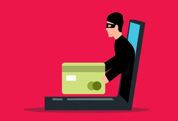 Hacker stealing credit card data from laptop, fraud and financial crime in Oakville Halton Region